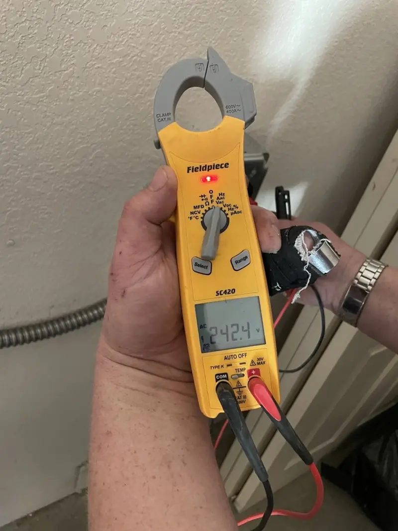 Voltage testing with clamp meter during Ceiling Fan Installation in Violet